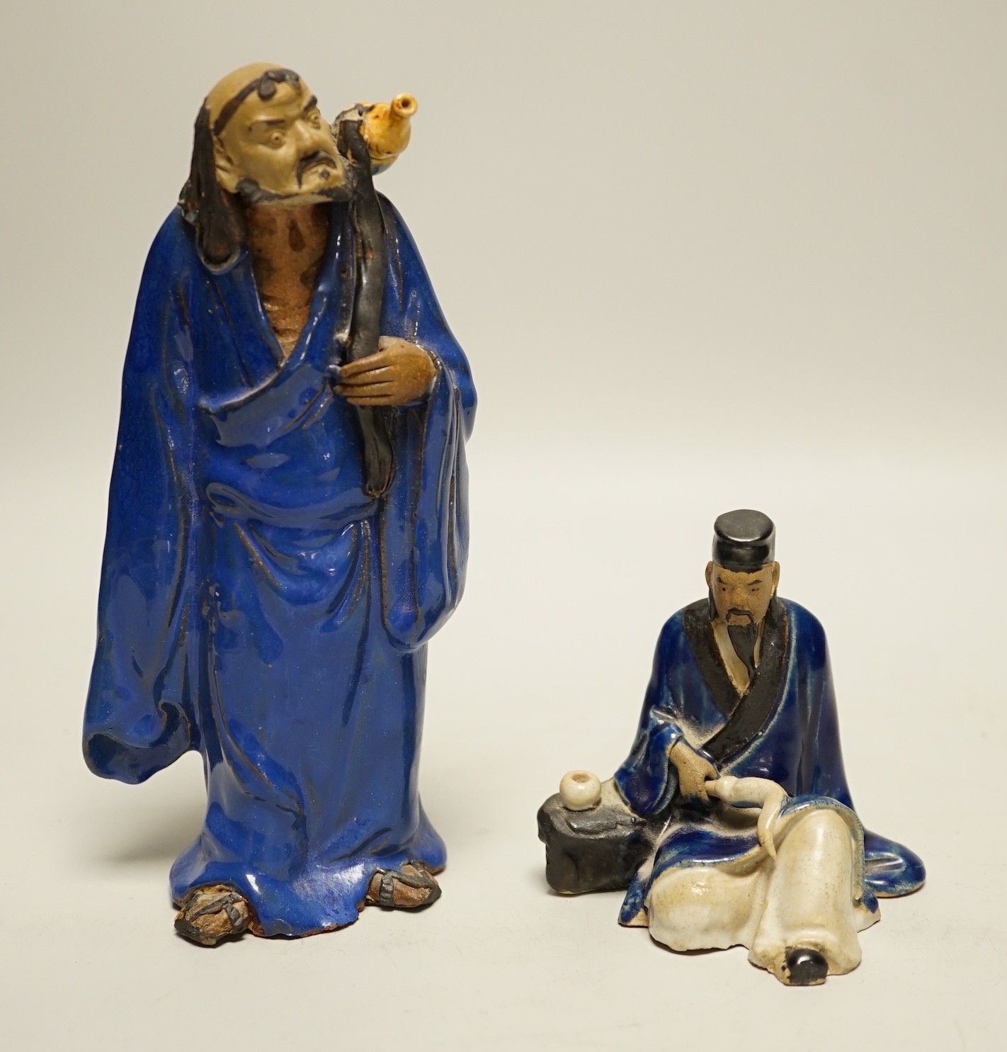 Two Chinese glazed pottery figures of Li Tieguai and Lu Dongbin, late 19th/early 20th century, largest 18cm